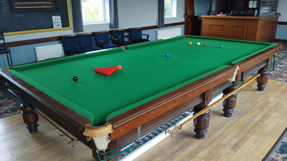 Pristine slate bed snooker table